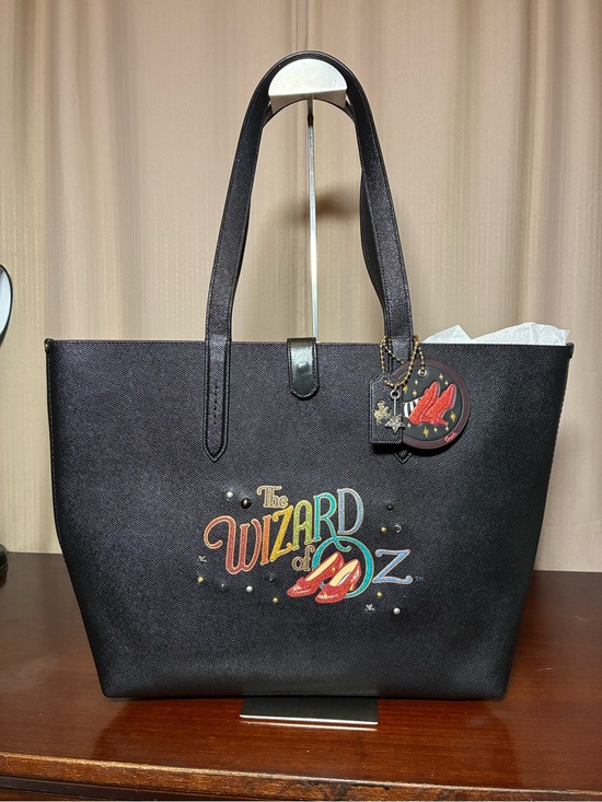 Coach Handbags - Coach x The Wizard of Oz Black Tote Bag with Red Ruby Slippers Charm NWT
